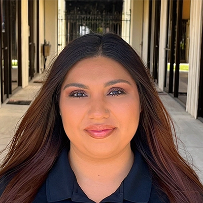 Neuropathy Technician Eva Perez Smiling In Collared Shirt