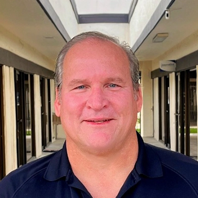 Case Manager Joe Ohman Smiling In Collared Shirt
