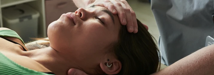 Woman Receiving Neck Adjustment
